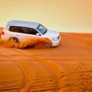 Luxury 4×4 Land Cruiser on Dubai desert dunes during safari 2025